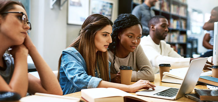 Two woman study together in a class.an s