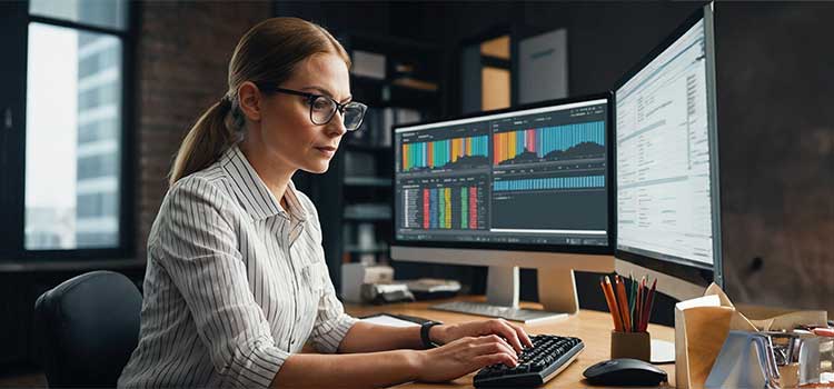 woman accountant preps to take the cpa exam on desktop computer
