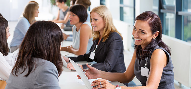 students talk to recruiters at a job fair