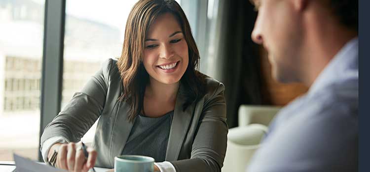 accountant shows client paperwork and financials