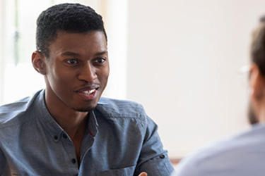 man interviews for job