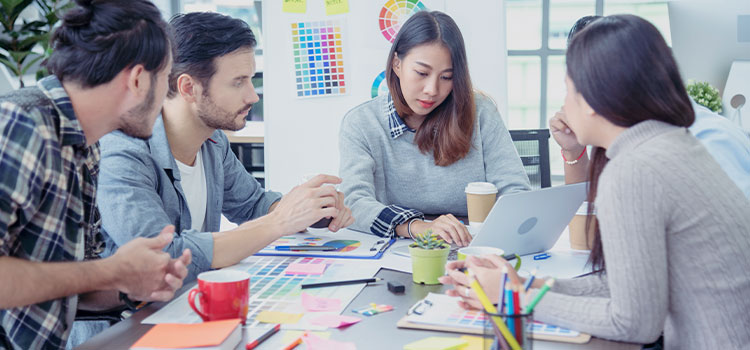A team working on a project discusses information