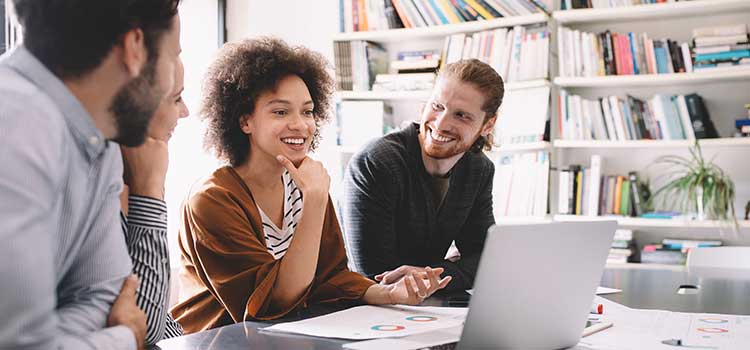 marketing manager shows her campaign and results to her marketing team