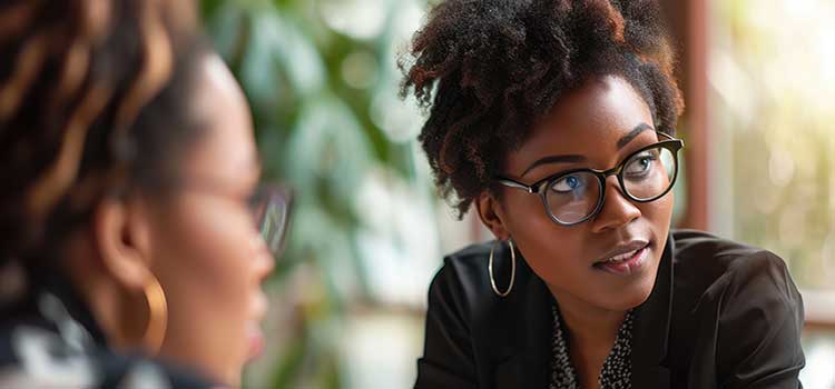 marketing professional looks pensive while listening to unseen team