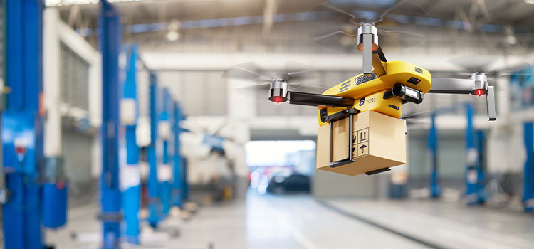 A drone carries a package through a warehouse