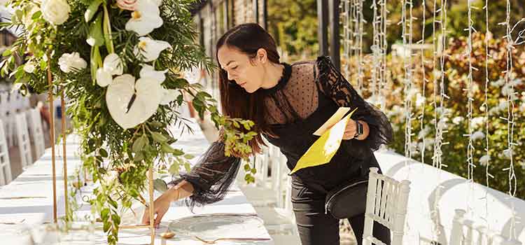wedding planner puts final touches on seating chart